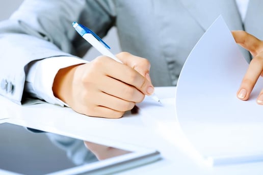 Close up businesswoman hands signing documents