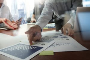 Double-exposure-of-businessman-hand-working-with-new-modern-computer-and-business-strategy-as-concept-300x200