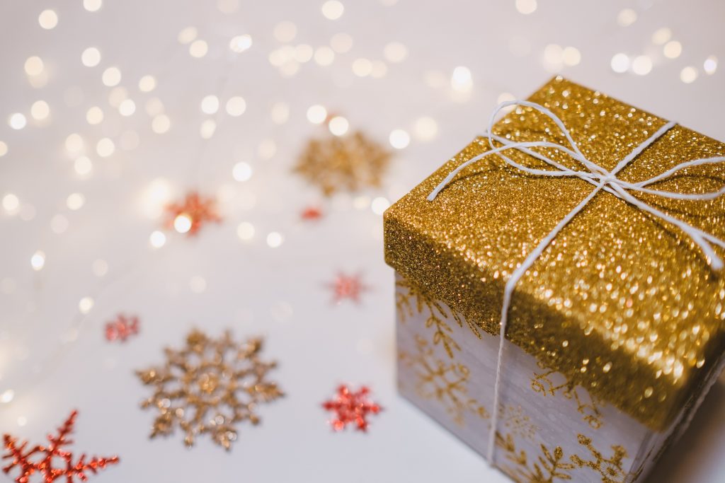 A golden gift box with snowflake decorations