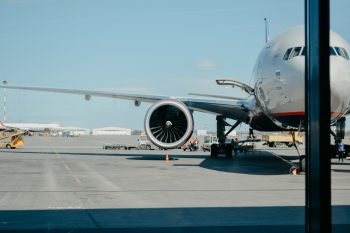 plane at the airport with focus on the right wing.