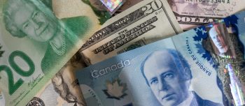Various money from different countries in a pile together