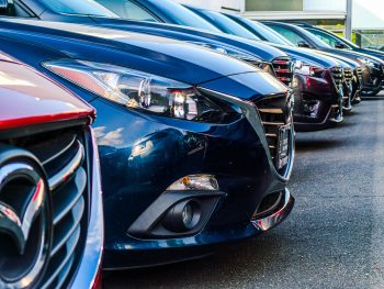 A line of cars in a lot.