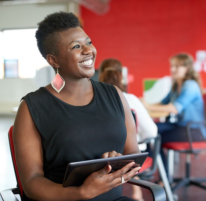 woman holding tablet