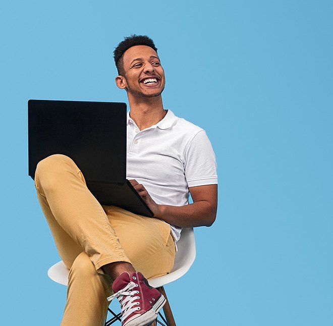 man sitting with laptop