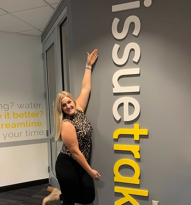 woman by issuetrak sign