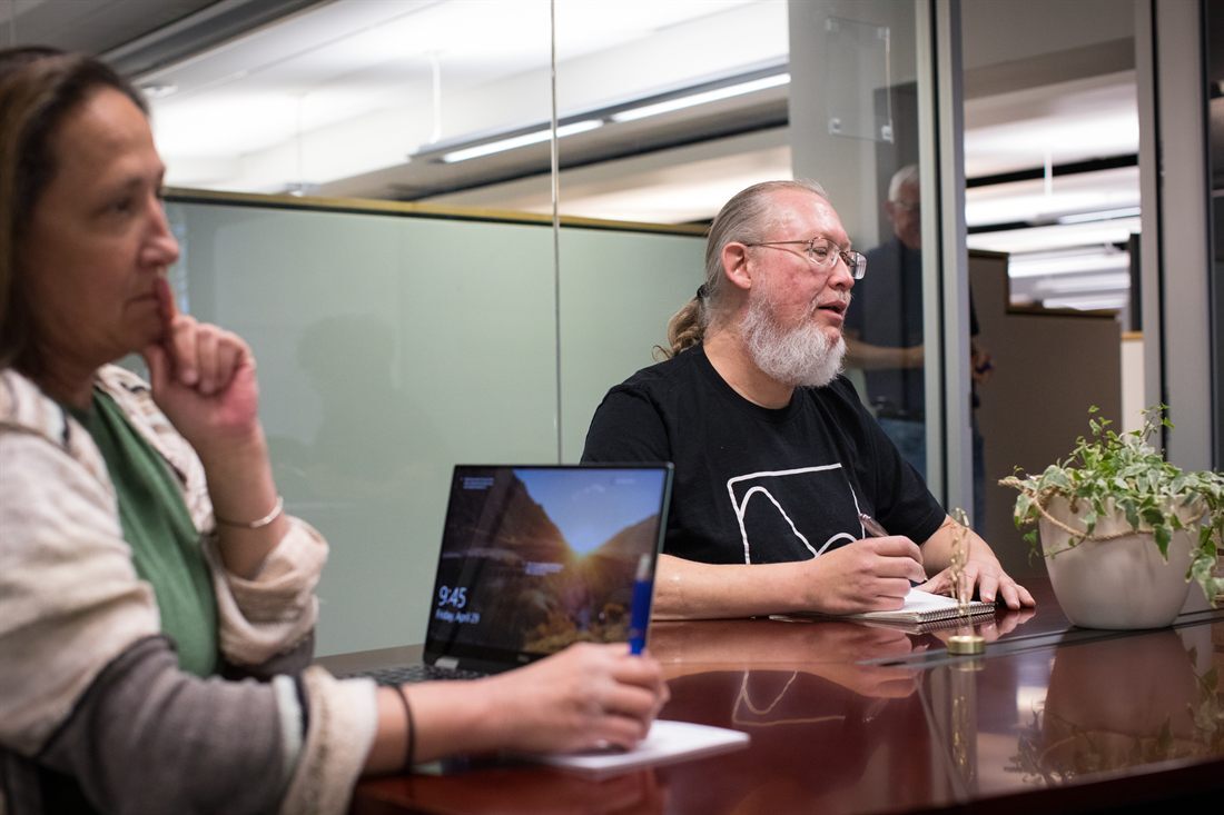 Issuetrak team members in a working meeting